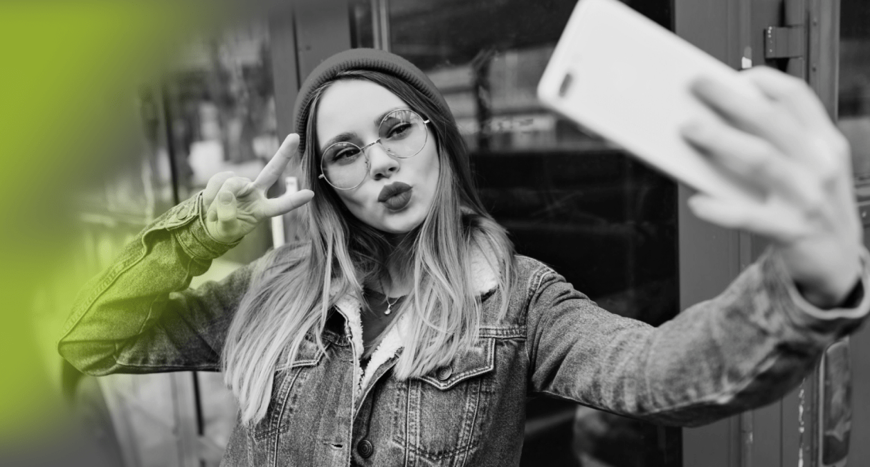 Woman taking a selfie with her phone
