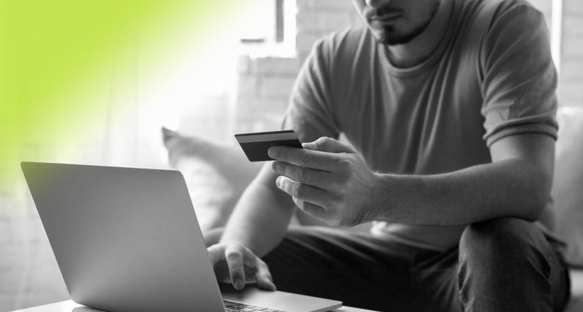 Man sitting at laptop representing global ecommerce expansion
